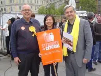 Chris Huhne, Merlene Emerson and Jonathan Fryer at Strangers into Citizens rally 4 May 2009