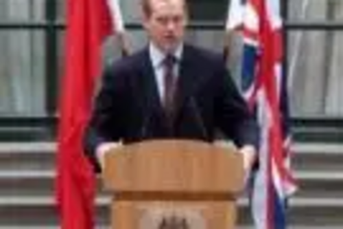 Jeremy Browne MP Minister of State at FCO with UK and China Flags.