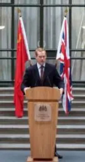 Jeremy Browne MP Minister of State at FCO with UK and China Flags.